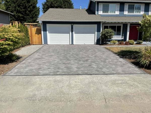 picture of a new concrete textured paver driveway 