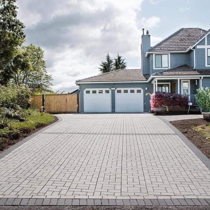 picture of a gray paver driveway for a two door garage