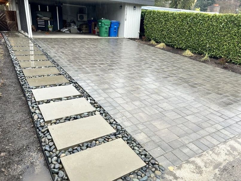 picture of a newly installed paver driveway with gray textured pavers