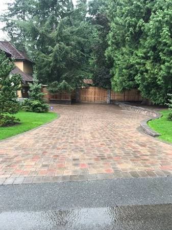 picture of a newly installed paver driveway with beige textured pavers