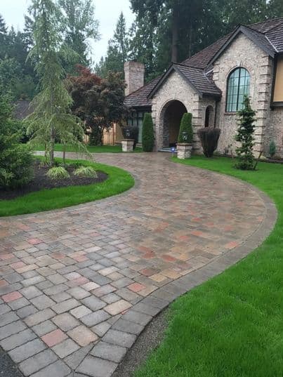 picture of a newly installed paver driveway with beige textured pavers