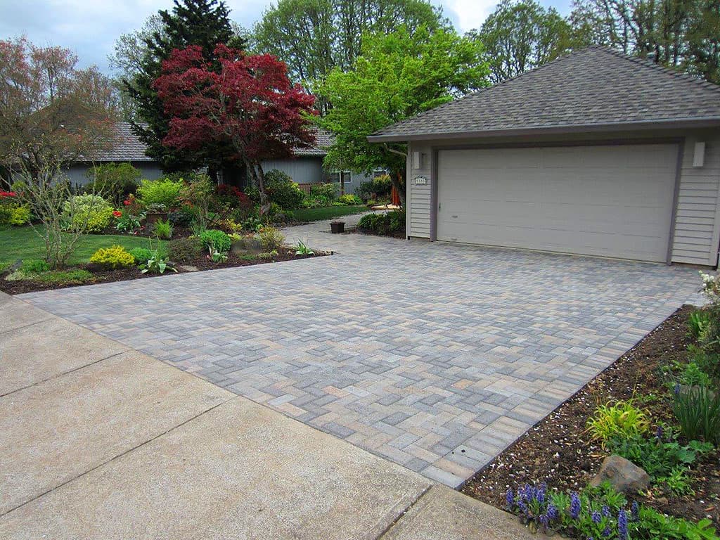 picture of a new concrete pavers garage driveway of gray textures 